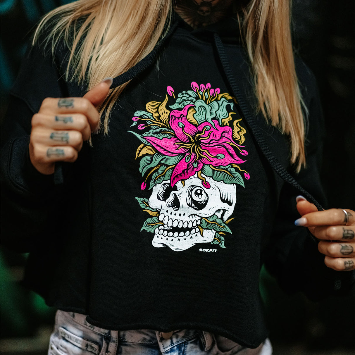Female model wearing women's crop hoody with 'Eternal Bloom' graphic